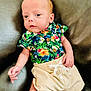 Kase joined the competition — help win amazing prizes! baby, infant, child, floral_shirt, shorts, hand, couch, leather, person, portrait, young, cute, casual_clothing, indoor, skin, head, face, eyes, small_hands, relaxing