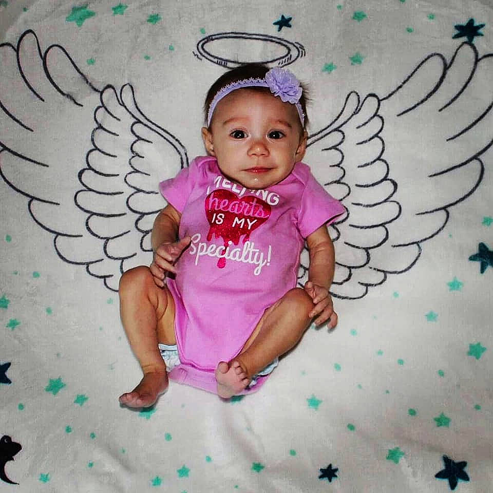 Azra is registered to the contest to win money with this photo: angel, art, baby, baby_toddler_clothing, child, drawing, fictional_character, head, headwear, illustration, person, pink, smile, supernatural_creature, toddler, wing