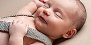 Eren participe au concours pour gagner de l'argent avec cette photo : baby, sleeping, infant, closeup, smile, skin, hand, head, ear, fabric, strap, comfort, peaceful, portrait, cute, newborn, rest, soft, human, child