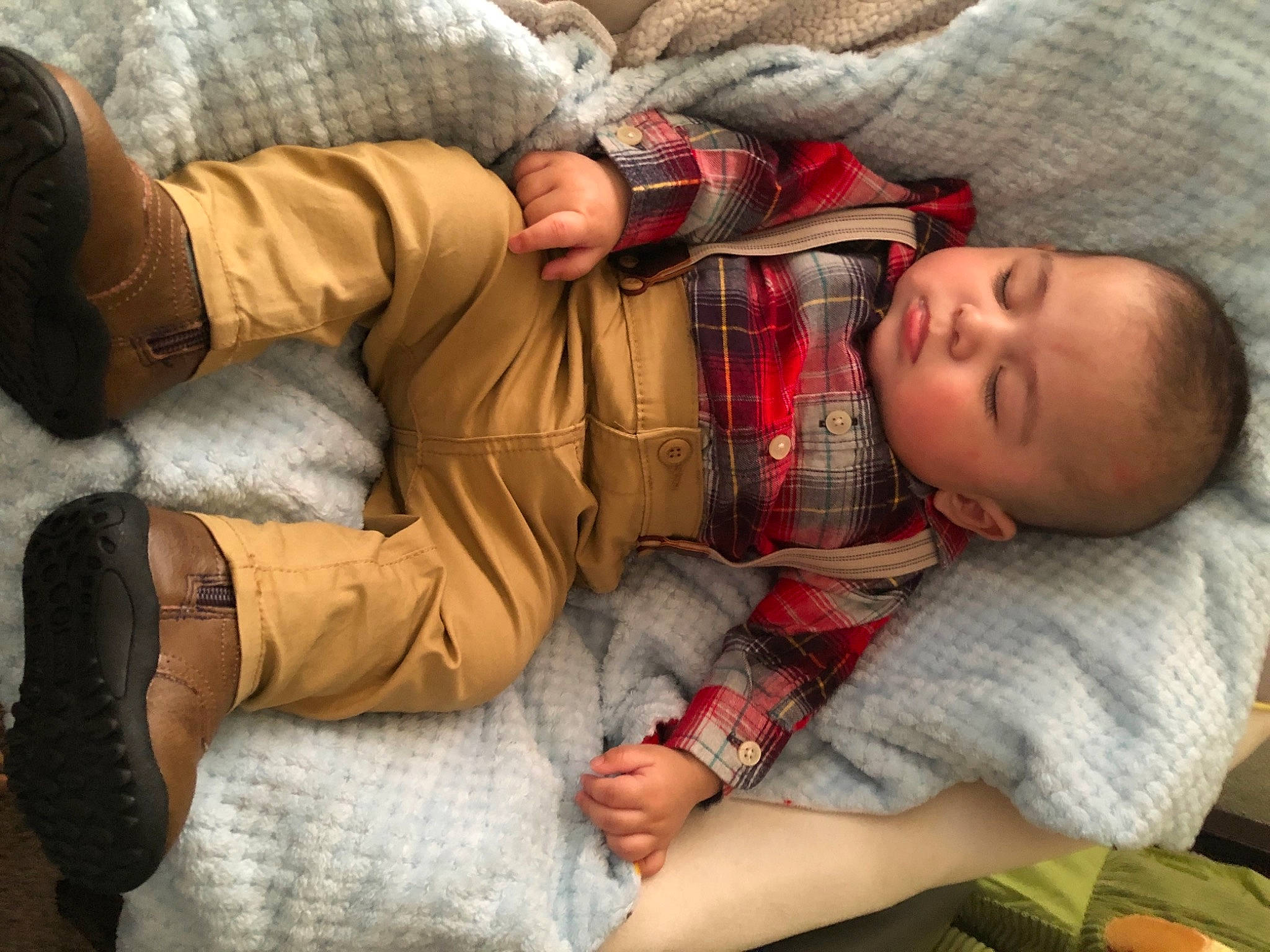 Jesus is registered to the contest to win money with this photo: abdomen, baby, baby_toddler_clothing, bedtime, child, comfort, human_leg, lap, leg, linens, nap, person, room, sitting, skin, textile, thigh, toddler, tree, trunk