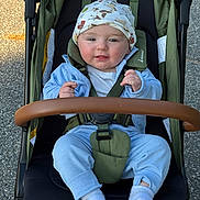 Luke Conrad Witte joined the competition — help win amazing prizes! baby, child, stroller, hat, blue_clothing, socks, outdoor, seatbelt, green_stroller, infant, cute, smiling, face, person, walking, pavement, daylight, casual, headwear, baby_toddler