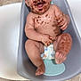 Jordan is registered to the contest to win money with this photo: baby, chocolate, messy, smiling, diaper, tub, floor, tile, happy, infant, cute, fun, child, sitting, skin, hand, foot, bracelet, mouth, face