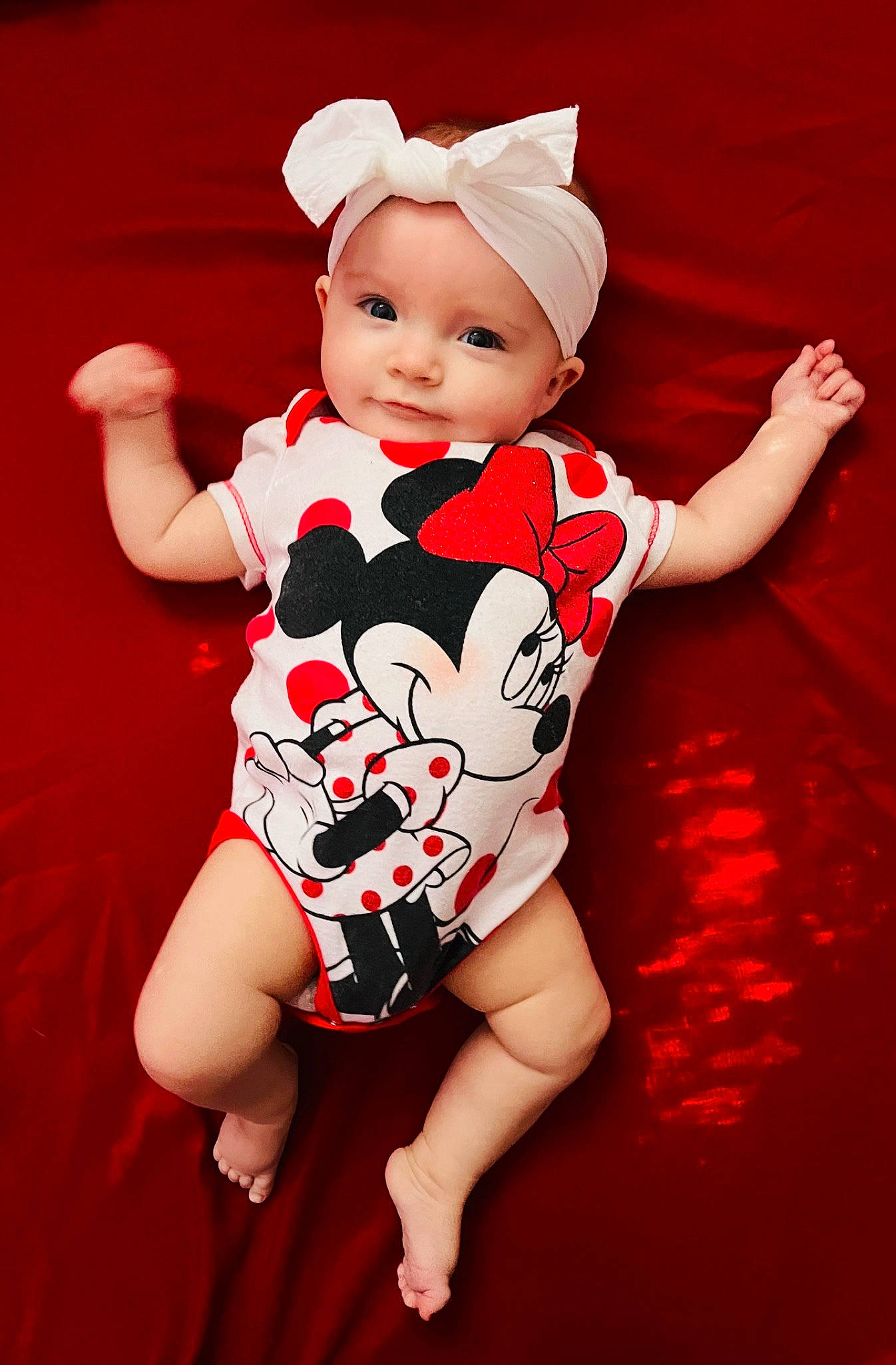 Scarlett is registered to the contest to win money with this photo: arm, baby, baby_toddler_clothing, carmine, costume_hat, finger, happy, headgear, headwear, human_body, human_leg, magenta, one_piece_garment, pattern, person, pink, shorts, sleeve, smile, t_shirt