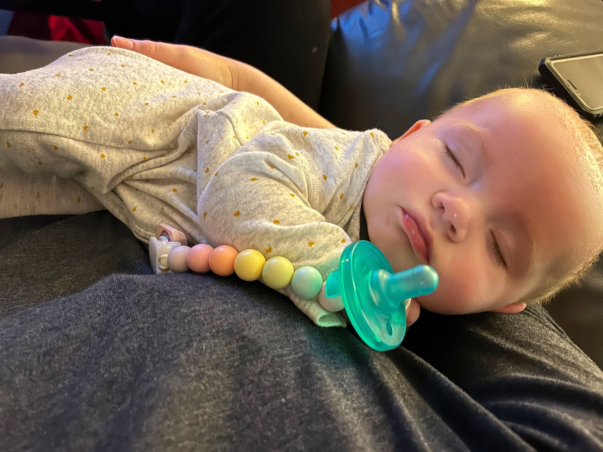 Scarlett is registered to the contest to win money with this photo: baby, baby_products, baby_toddler_clothing, cheek, child, comfort, fashion_accessory, finger, fun, grass, hairstyle, headgear, iris, linens, mouth, pattern, person, sitting, skin, toddler