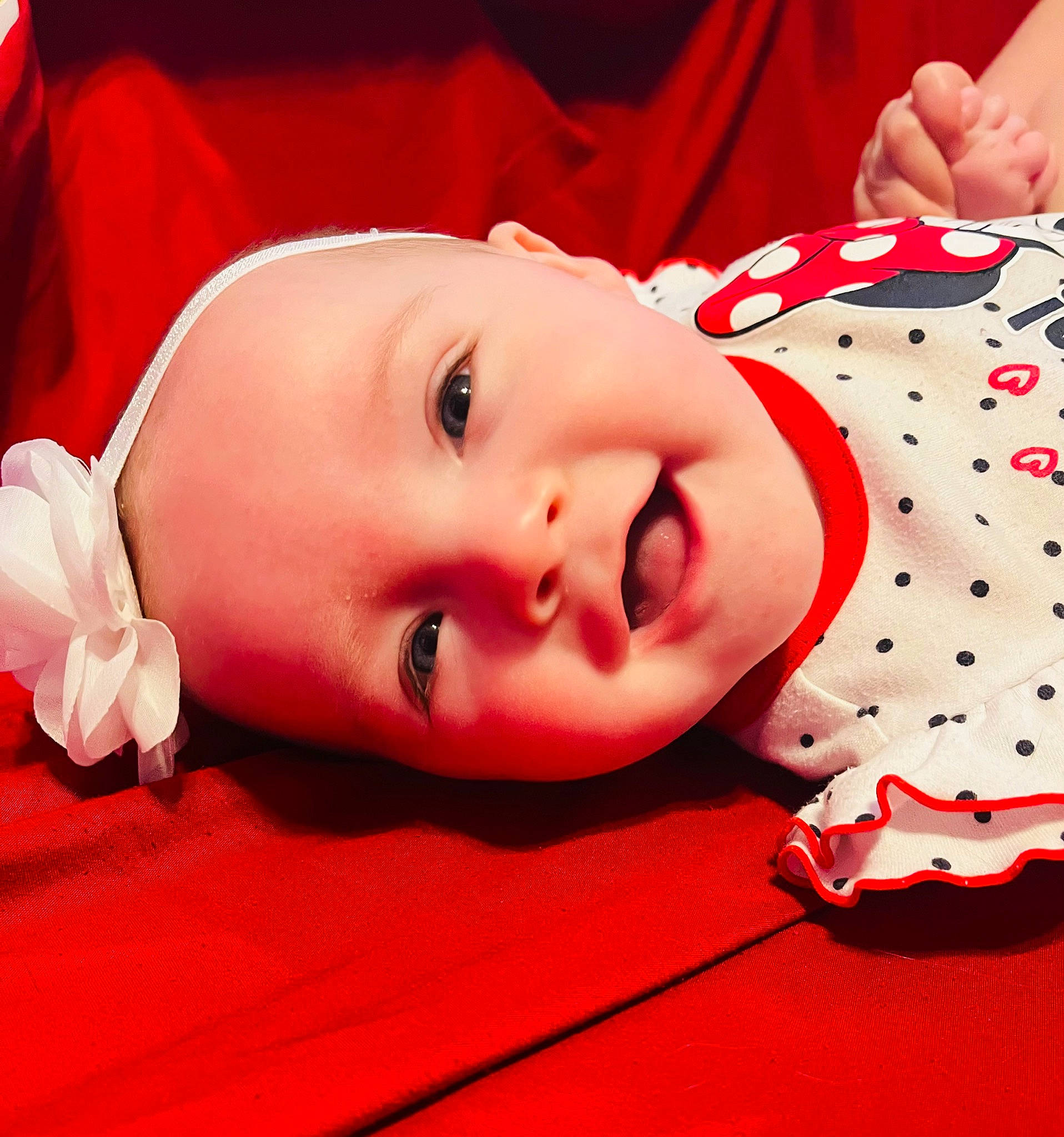 London joined the competition — help win amazing prizes! baby, baby_toddler_clothing, beauty, cheek, child, chin, eye, eyelash, face, facial_expression, happy, lip, mouth, pattern, person, pink, product, red, skin, sleeve