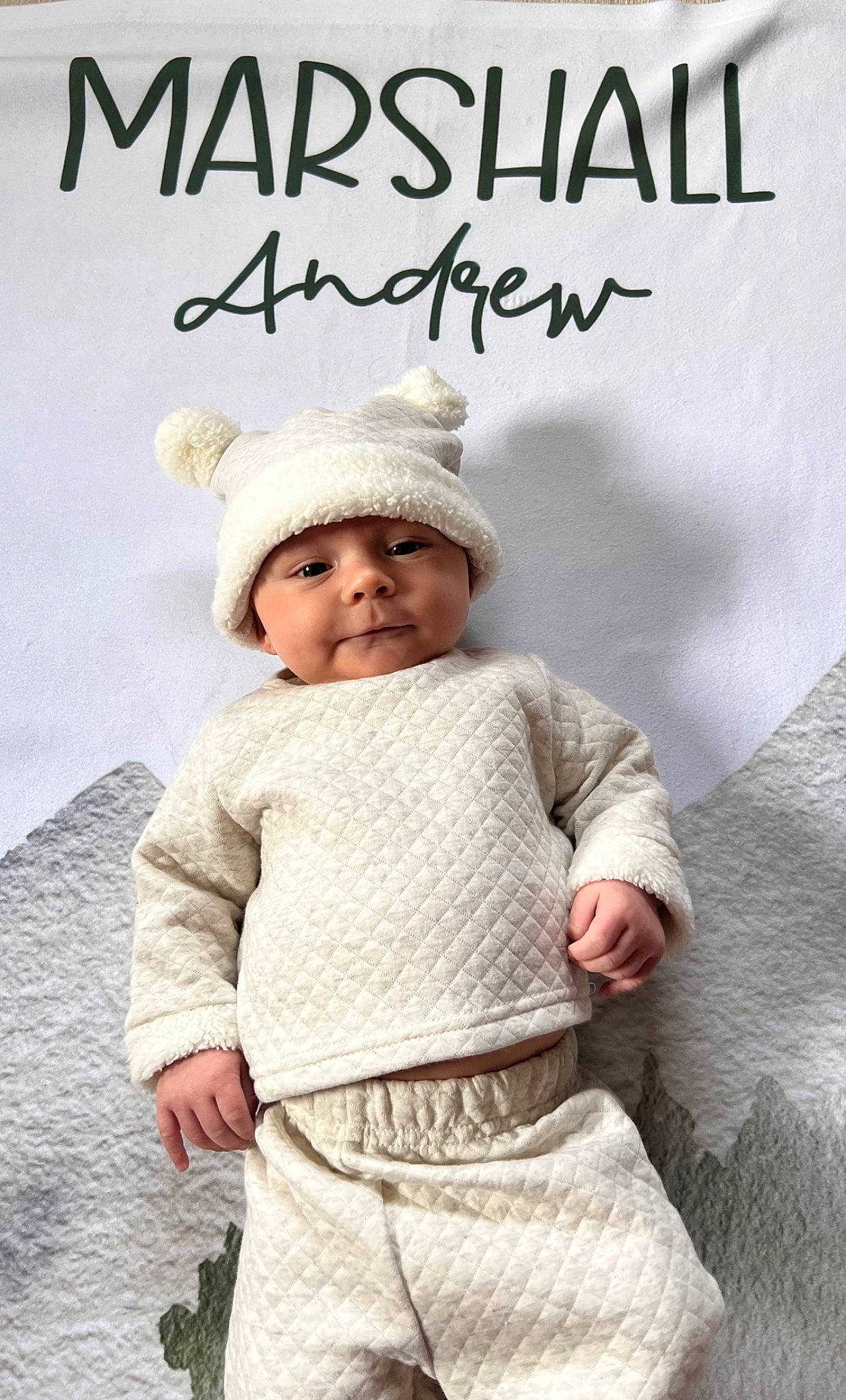 Marshall is registered to the contest to win money with this photo: baby, baby_toddler_clothing, cap, child, font, fur, happy, hat, headwear, linens, outerwear, pattern, people, person, photo_caption, portrait_photography, sleeve, smile, stock_photography, toddler