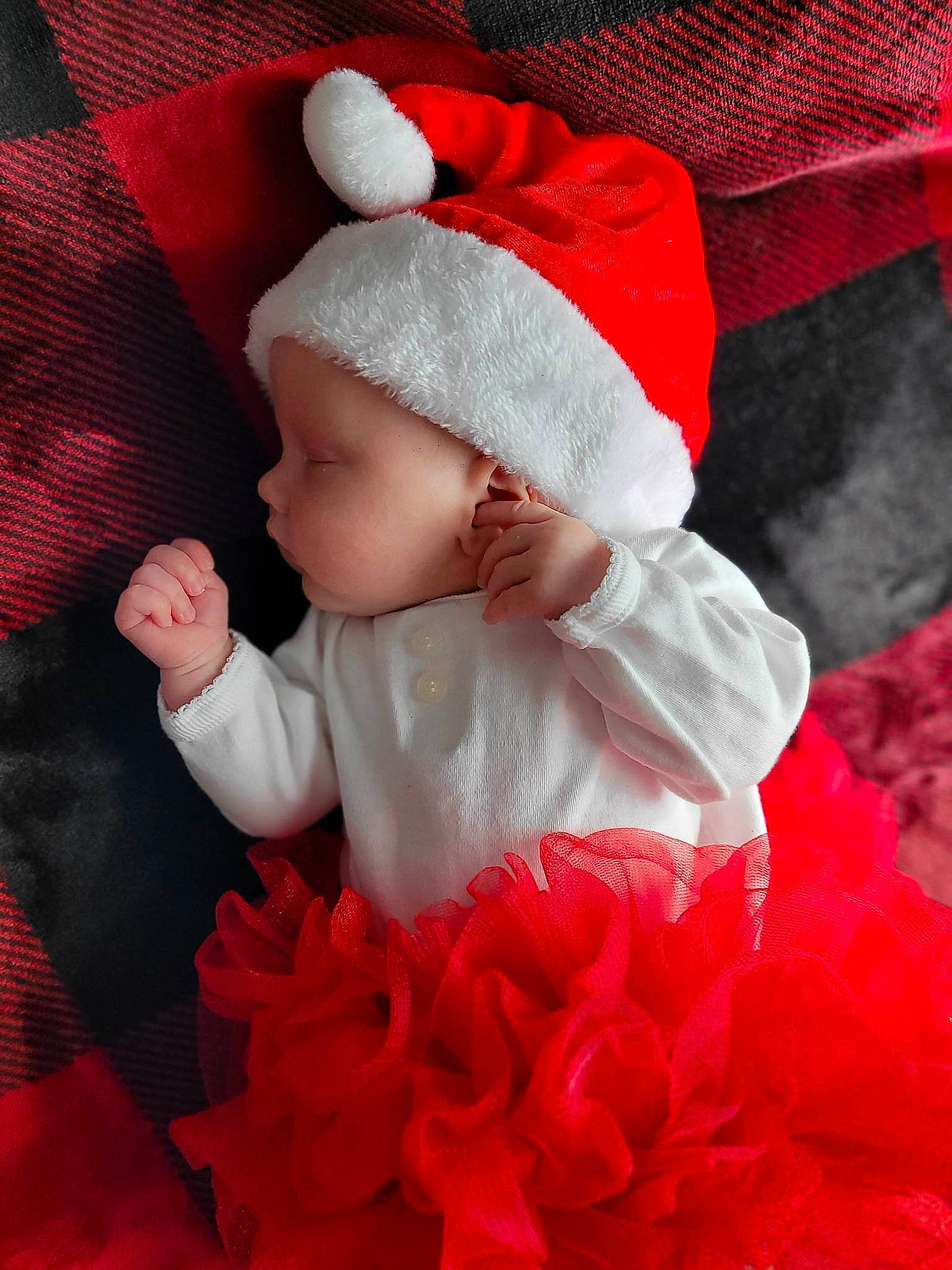 Gracelynn is registered to the contest to win money with this photo: baby, baby_toddler_clothing, cap, carmine, child, comfort, costume_hat, event, fictional_character, happy, hat, magenta, outerwear, person, petal, pink, red, santa_claus, sleeve, textile