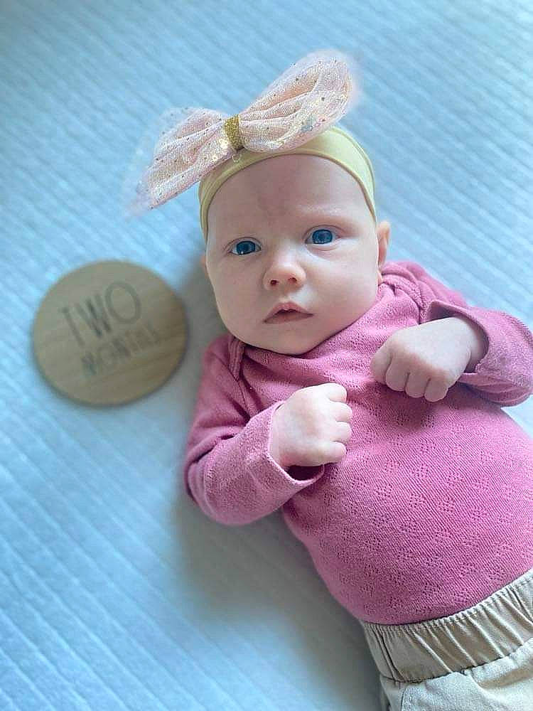Gracelynn joined the competition — help win amazing prizes! baby, baby_products, baby_toddler_clothing, child, eye, fashion_accessory, finger, head, headband, headpiece, headwear, magenta, person, pink, product, skin, sleeve, textile, thumb, toddler