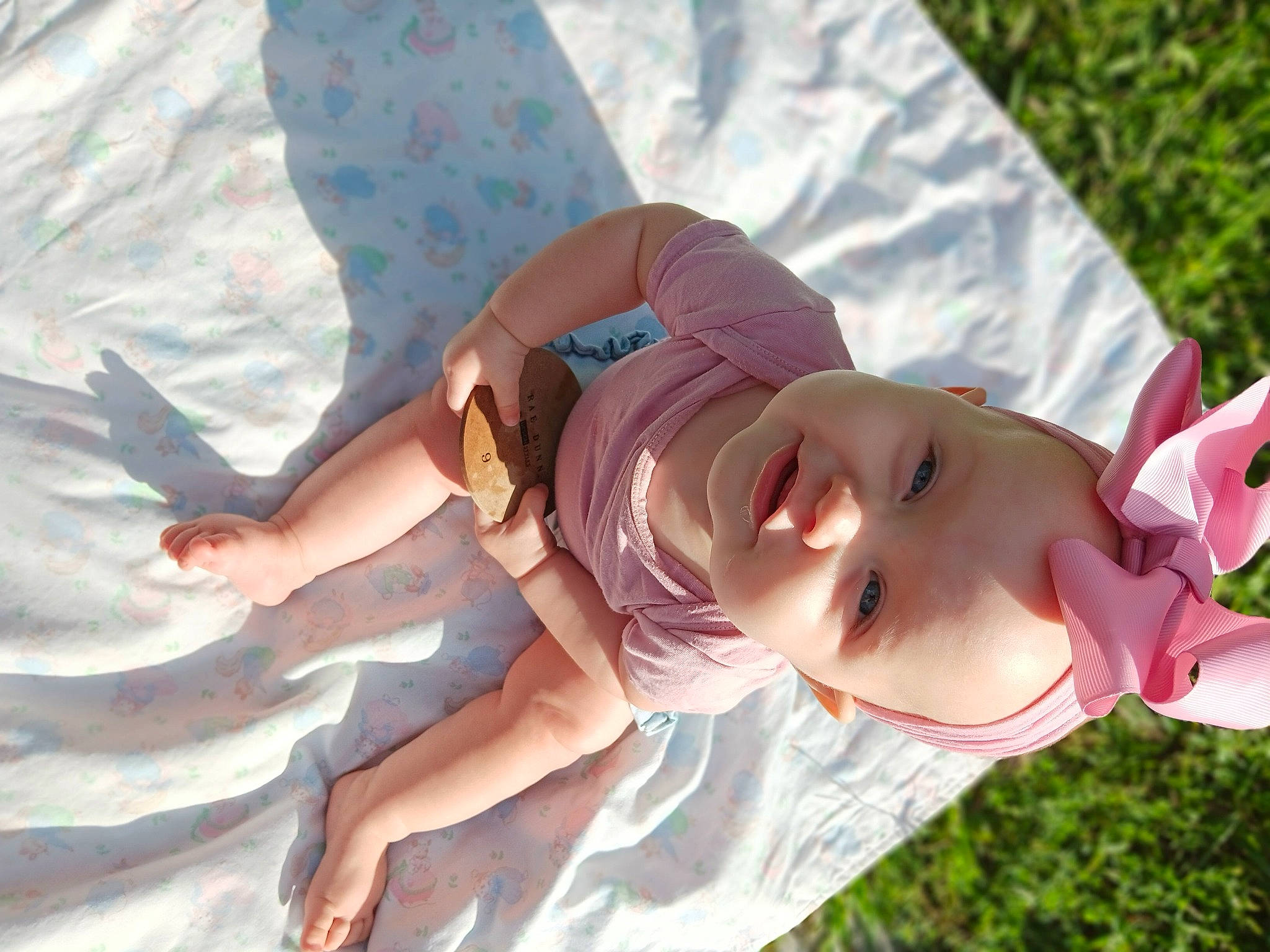Gracelynn is registered to the contest to win money with this photo: baby, baby_toddler_clothing, child, fashion_accessory, finger, fun, grass, happy, hat, leisure, pattern, people_in_nature, person, plant, recreation, smile, summer, sun_hat, toddler, vacation