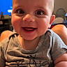 Theo is registered to the contest to win money with this photo: baby, casual_clothing, child, closeup, cute, eyes, face, foot, hand, happy, head, indoor, infant, joy, mouth, person, short_sleeve, skin, smiling, teething_toy