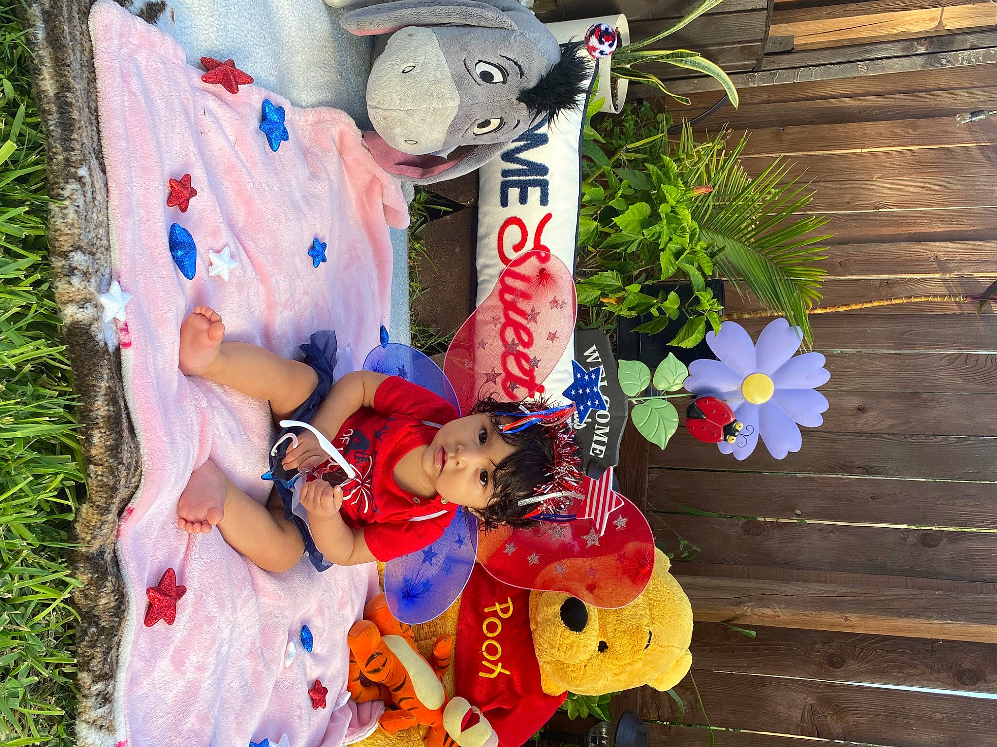 Madison joined the competition — help win amazing prizes! carmine, child, costume, event, fictional_character, floral_design, flowerpot, fun, happy, leisure, person, petal, plant, spring, stuffed_toy, toy, tradition, tree, vacation, white