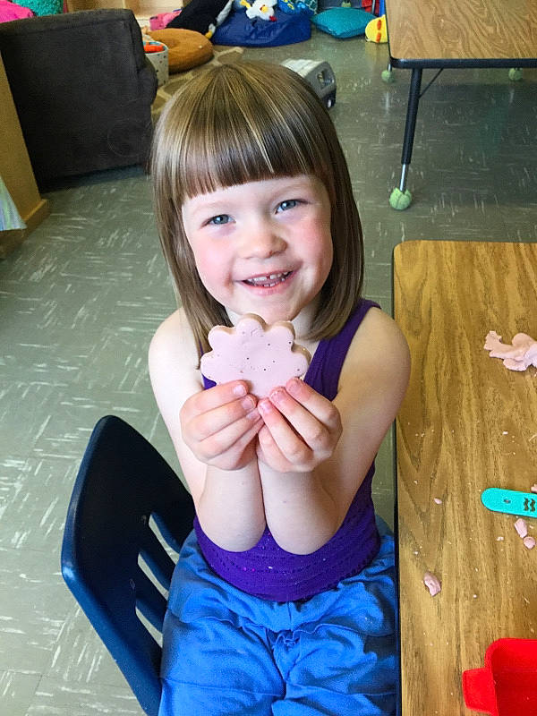 Kaia is registered to the contest to win money with this photo: black_hair, chair, dress, eye, finger, gesture, hair, hand, happy, head, human_body, iris, joy, leisure, mouth, nail, neck, person, skin, smile