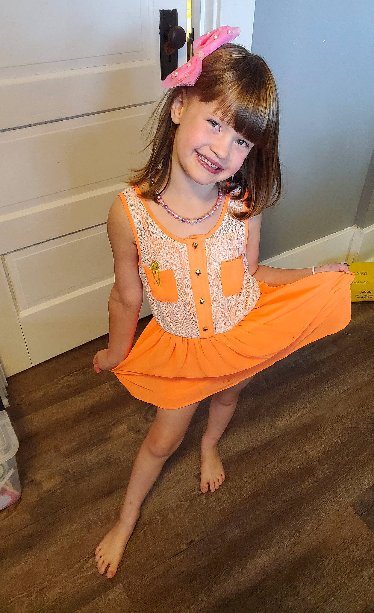 Kaia is registered to the contest to win money with this photo: beauty, day_dress, dress, face, fashion_design, floor, flooring, fun, hair, happy, human_body, joy, knee, orange, person, skin, sleeve, smile, thigh, trunk