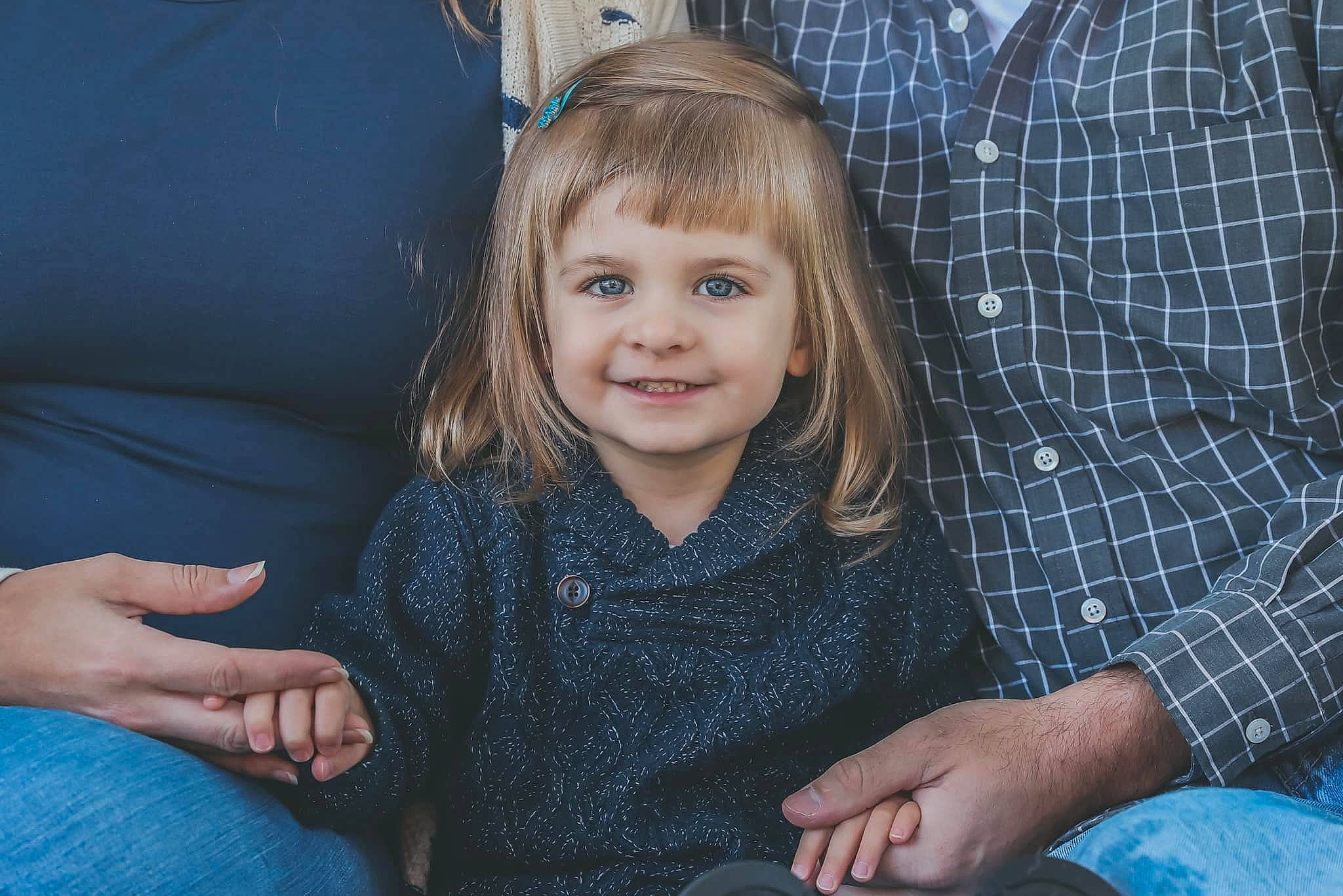 Jossalyn is registered to the contest to win money with this photo: blond, child, eye, face, family, fawn, finger, fun, hand, iris, joy, people, person, sitting, smile, toddler, vacation