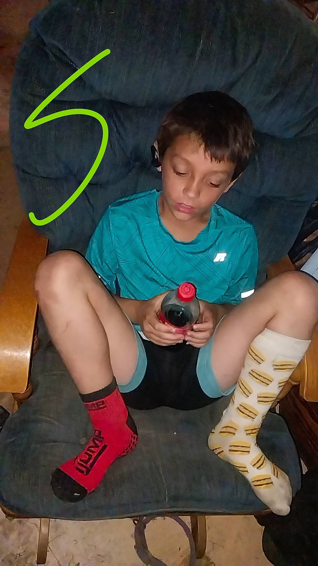 Christopher Jr. joined the competition — help win amazing prizes! boot, cool, elbow, event, flash_photography, foot, fun, hairstyle, human_leg, joint, knee, lap, leg, person, sandal, shorts, sitting, sneakers, sock, t_shirt