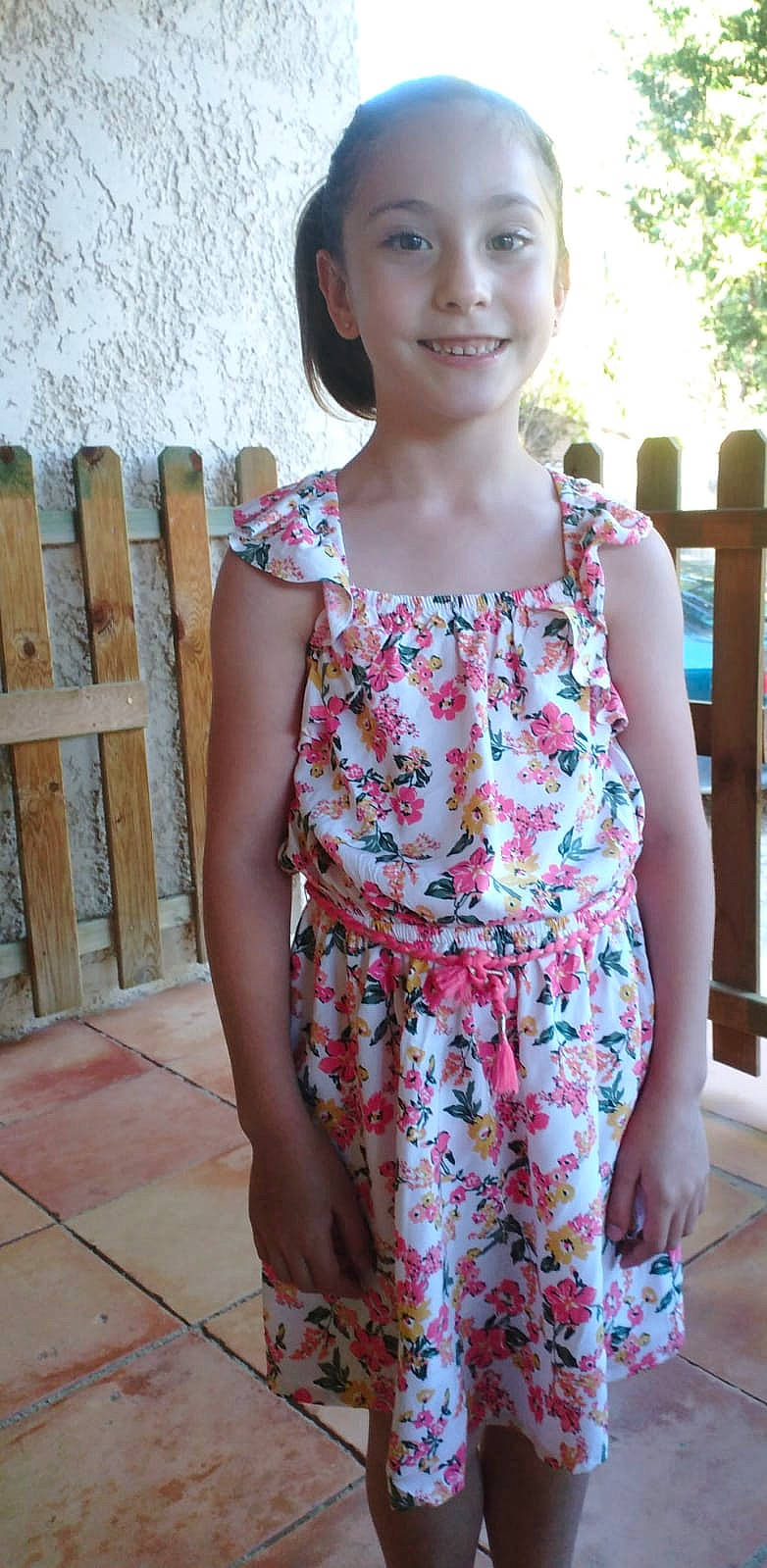 Axelle participe au concours pour gagner de l'argent avec cette photo : child, clothing, day_dress, eye, facial_expression, formal_wear, hair, happy, joy, magenta, neck, one_piece_garment, pattern, person, pink, shoulder, skin, sleeve, smile, thigh