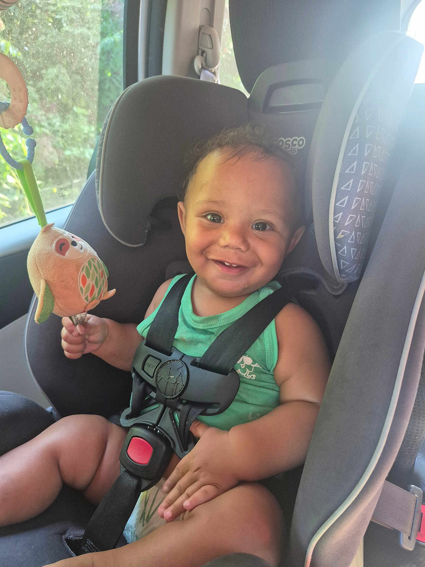Kayden joined the competition — help win amazing prizes! child, toddler, car_seat, smile, toy, plush_toy, car_interior, seatbelt, window, sunlight, greenery, happy, sitting, infant, clothing, safety, baby, cute, indoors, portrait