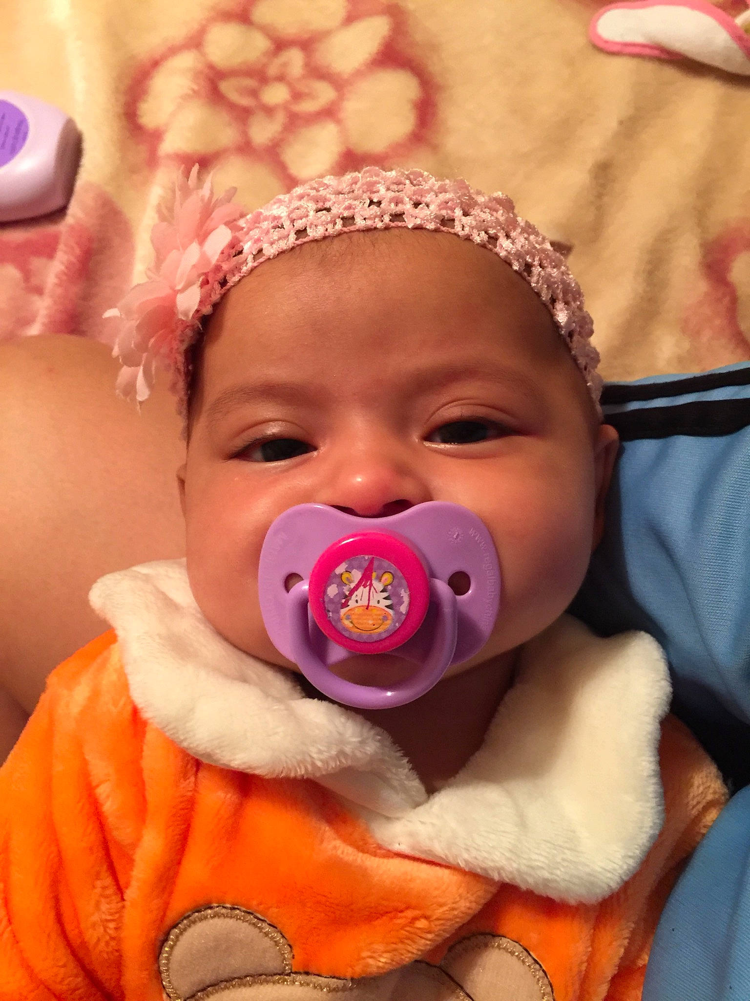 Monique joined the competition — help win amazing prizes! baby, cheek, child, face, hair_accessory, head, mouth, nose, person, pink, skin, toddler, tongue