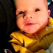 Zuri joined the competition — help win amazing prizes! baby, blanket, clothing, coat, face, happy, hat, head, hoodie, jacket, knitwear, newborn, person, photography, portrait, quilt, smile, sweater, sweatshirt, towel