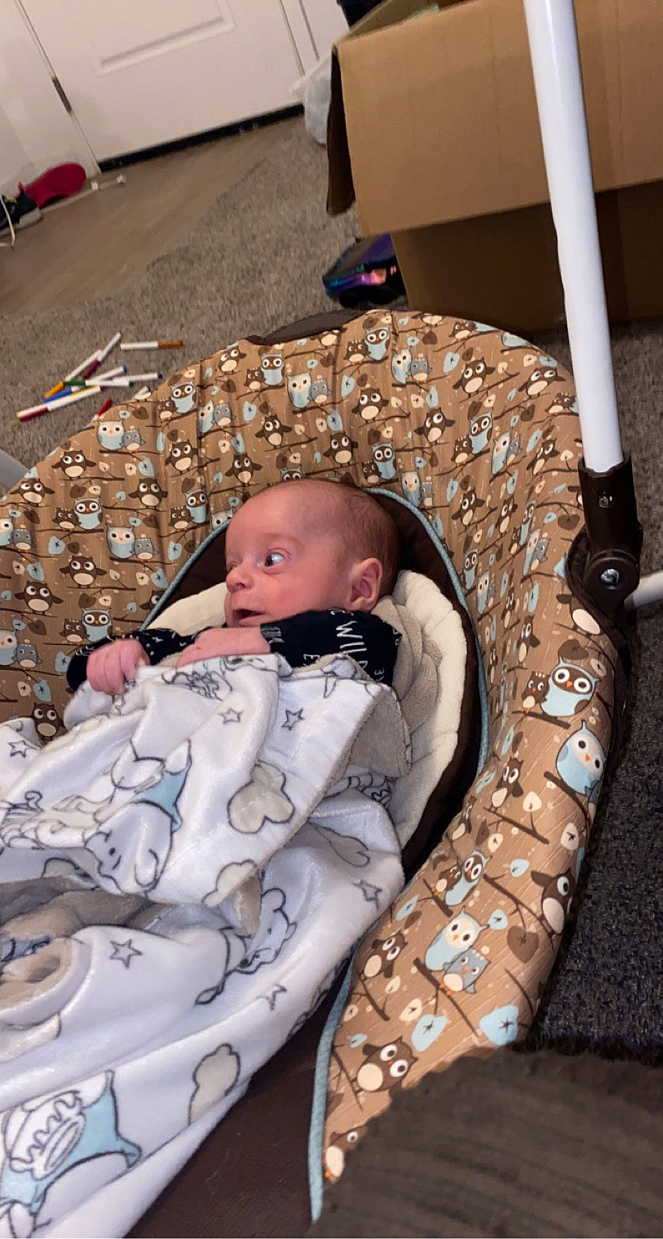 Emerson is registered to the contest to win money with this photo: baby, baby_carriage, baby_products, baby_safety, baby_toddler_clothing, camouflage, child, comfort, fashion_accessory, flooring, infant_bed, military_camouflage, pattern, person, product, room, sitting, toddler, wood
