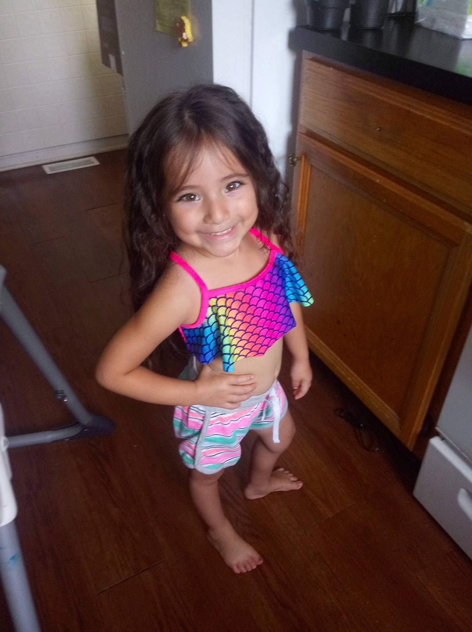 Hadassah is registered to the contest to win money with this photo: child, floor, flooring, joy, pattern, person, skin, smile, standing, toddler