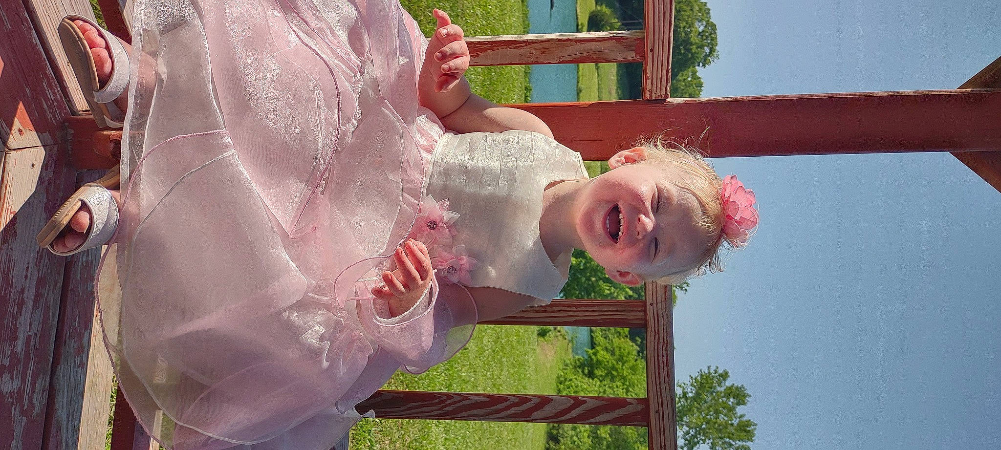 Remi joined the competition — help win amazing prizes! baby_toddler_clothing, child, face, fun, gesture, grass, happy, leisure, magenta, people_in_nature, person, pink, plant, play, recreation, red, skin, sky, smile, toddler