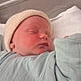 Léon participe au concours pour gagner de l'argent avec cette photo : newborn, baby, sleeping, hat, blanket, hospital, bassinet, infant, soft, peaceful, cozy, clothing, portrait, cute, child, wrapped, resting, face, closeup, toddler