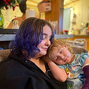Piper joined the competition — help win amazing prizes! child, person, sleeping, purple_hair, cast, arm_cast, couch, indoor, cozy, smile, hair, young_person, resting, family, affection, comfort, casual_clothing, home, relaxation, toddler