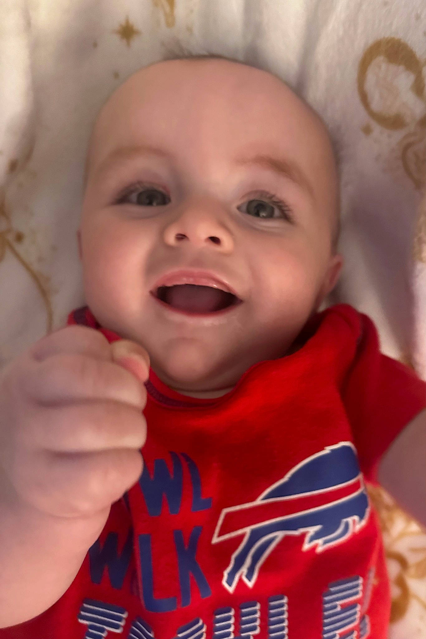 Lucious is registered to the contest to win money with this photo: baby, cheek, chin, eye, eyelash, finger, fun, gesture, happy, head, iris, lip, mouth, nose, person, pink, skin, sleeve, smile, toddler