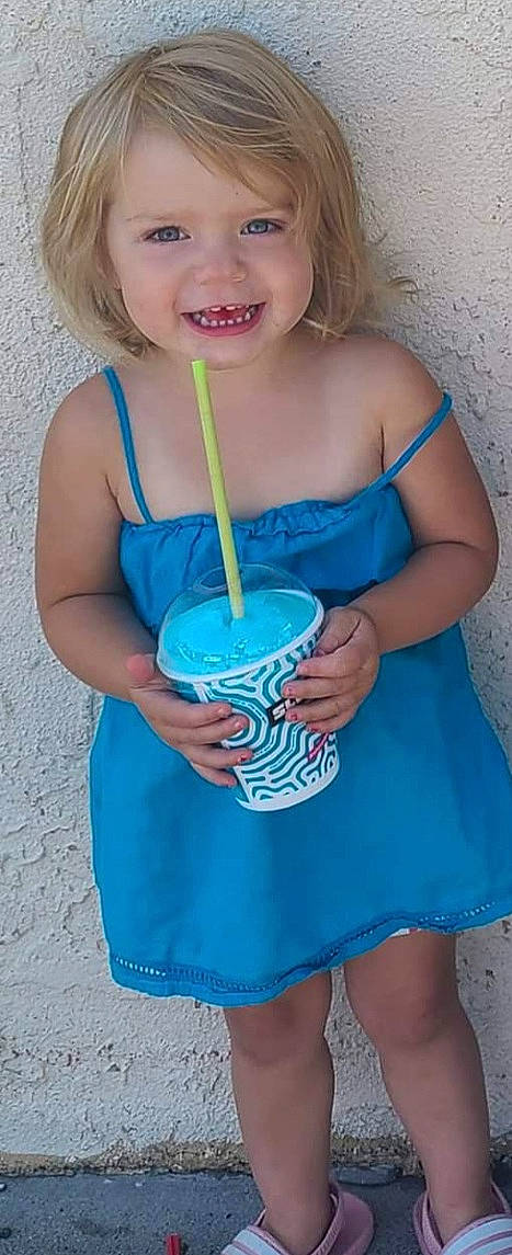 Ensleigh is registered to the contest to win money with this photo: aqua, arm, azure, baby_toddler_clothing, blue, clothing, drink, drinking_straw, drinkware, electric_blue, finger, green, hand, happy, joy, juice, pattern, person, sleeve, smile