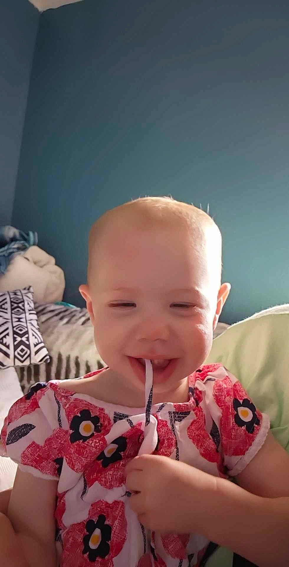 Renesmee joined the competition — help win amazing prizes! baby, baby_toddler_clothing, cheek, child, comfort, eyebrow, eyelash, fun, happy, human_body, iris, joy, lip, mouth, nose, person, pink, sitting, skin, smile