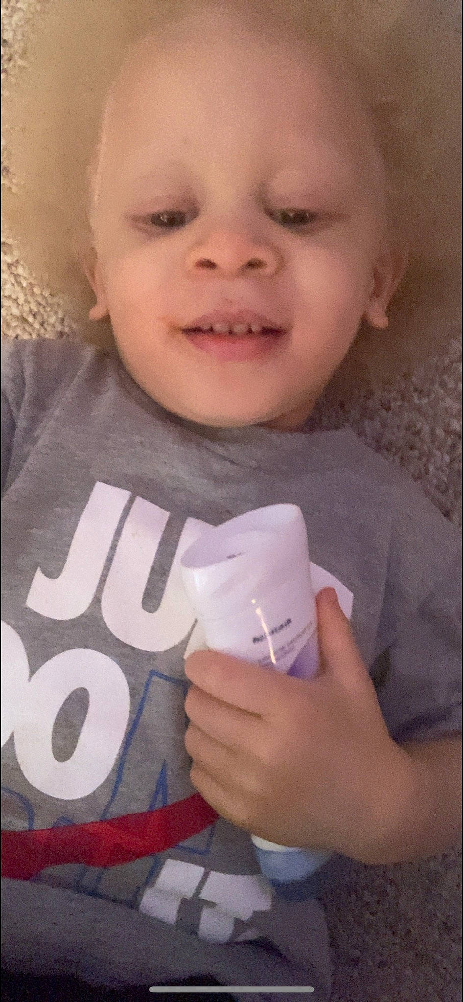 Lucci is registered to the contest to win money with this photo: baby_toddler_clothing, cheek, chin, drinkware, eyebrow, eyelash, facial_expression, finger, gesture, hairstyle, hand, happy, iris, lip, mouth, neck, nose, person, skin, sleeve