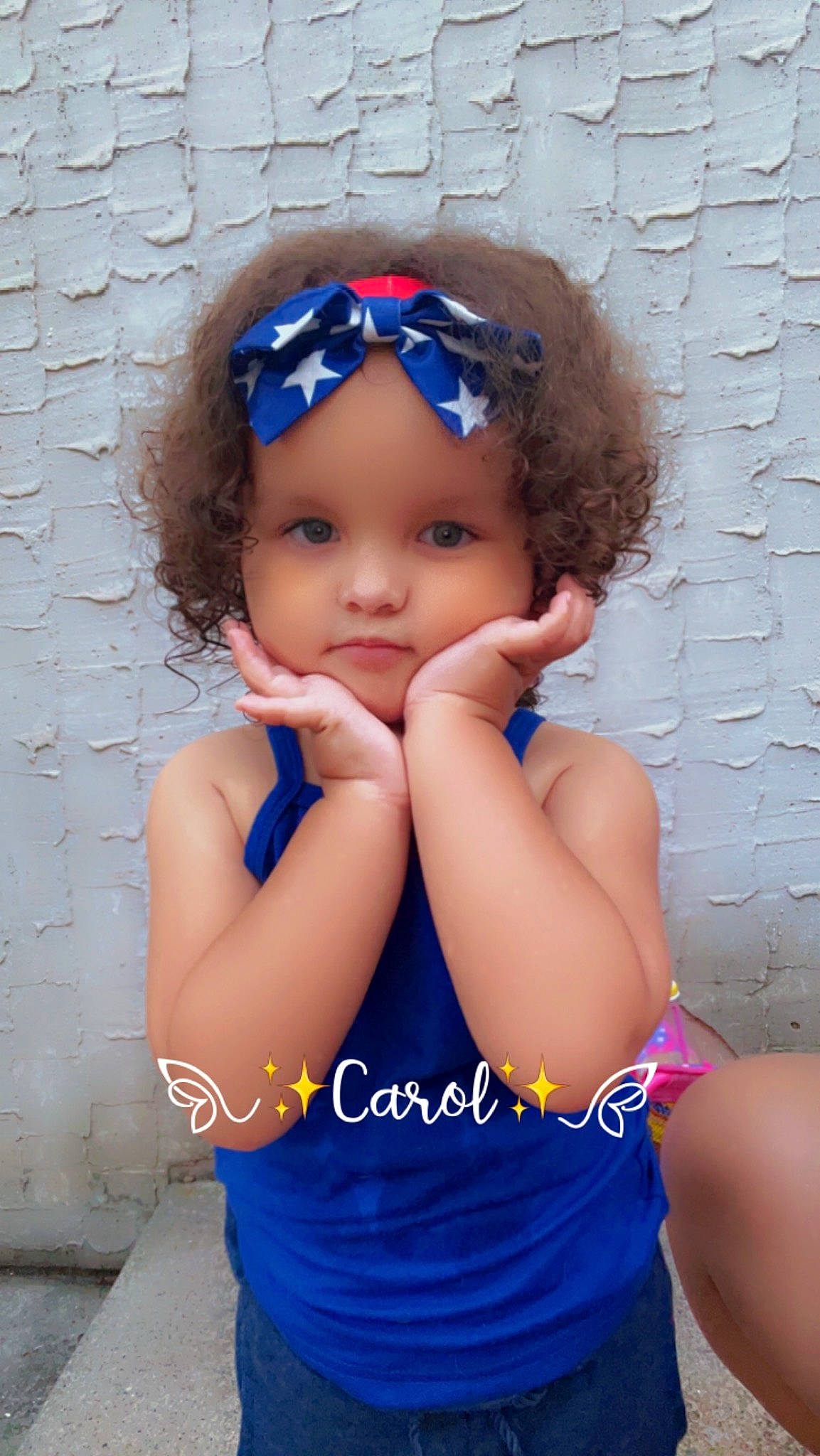 Kenzlee is registered to the contest to win money with this photo: azure, baby_toddler_clothing, black_hair, child, electric_blue, face, facial_expression, gesture, goggles, happy, head, headwear, lip, magenta, pattern, person, pink, purple, skin, sunglasses