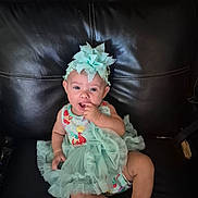 Serenity Norton is registered to the contest to win money with this photo: baby, child, dress, headband, sitting, couch, leather, cute, infant, sock, adorable, portrait, indoor, clothing, person, smiling, young, fashion, happy, toddler