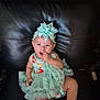 baby, child, dress, headband, sitting, couch, leather, cute, infant, sock, adorable, portrait, indoor, clothing, person, smiling, young, fashion, happy, toddler