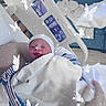 Leonard Thomas is registered to the contest to win money with this photo: adorable, baby, bassinet, blanket, butterflies, close_up, crib, face, hat, hospital, indoor, infant, medical_equipment, newborn, peaceful, portrait, sleeping, sparkles, striped_clothing, swaddled