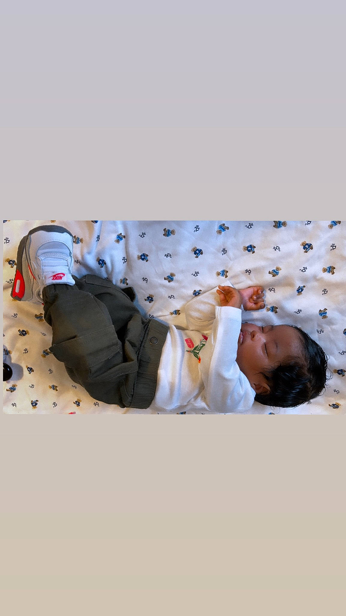 Jalaya is registered to the contest to win money with this photo: baby_sleeping, bed, bedding, comfort, dress_shirt, flooring, font, happy, human_body, knee, leisure, linens, pattern, person, product, room, sitting, sleeve, sock, t_shirt
