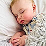 Oliver is registered to the contest to win money with this photo: baby, sleeping, blanket, pillow, hand, face, infant, cozy, soft, cute, child, rest, peaceful, indoors, closeup, portrait, warm, skin, clothing, nap