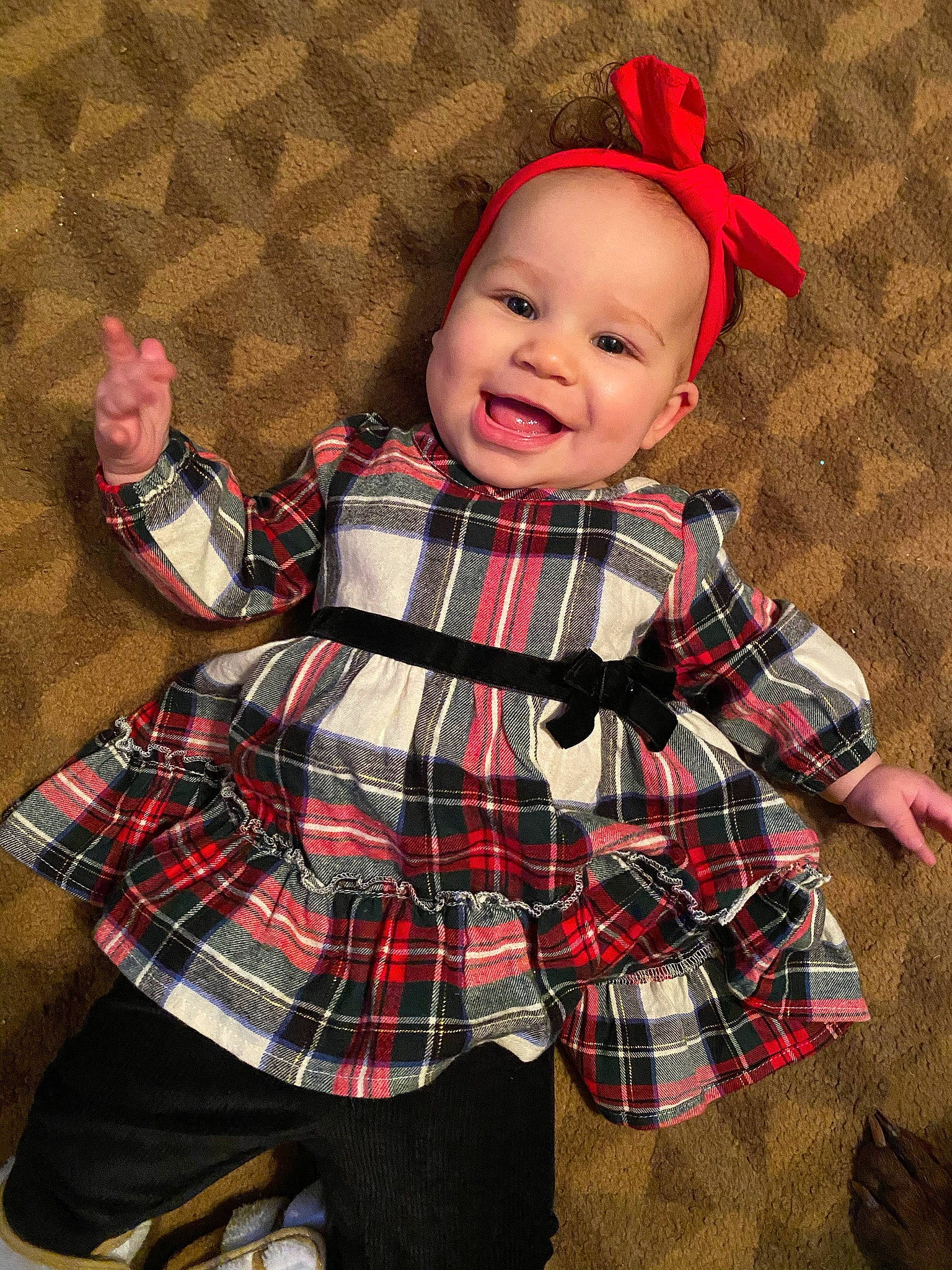 Marianna is registered to the contest to win money with this photo: baby, baby_toddler_clothing, beauty, child, collar, dress, fun, happy, joy, mammal, outerwear, pattern, person, pink, plaid, product, red, sleeve, smile, tartan