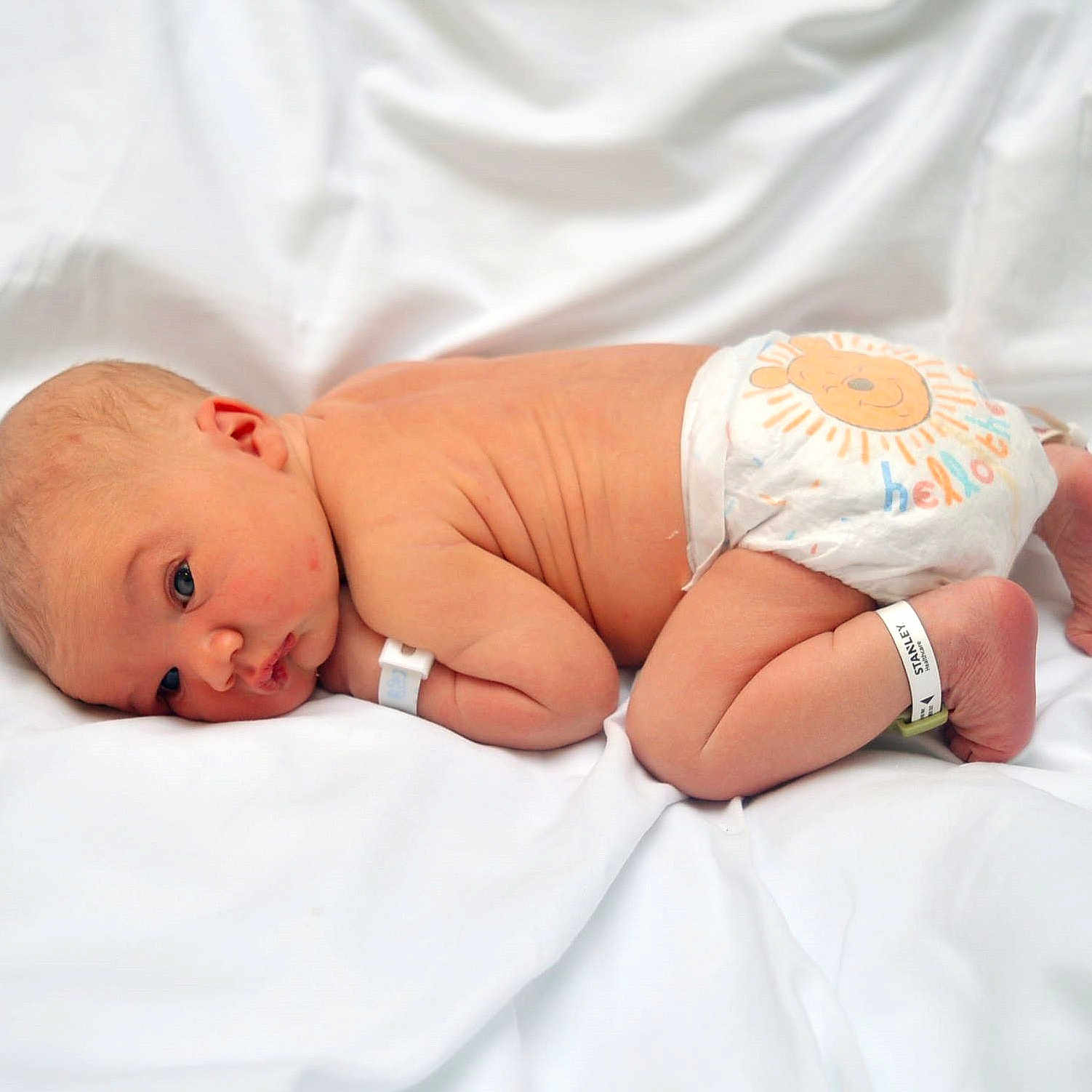 Benjamin joined the competition — help win amazing prizes! accessories, architecture, baby, bed, bodypart, building, clothing, diaper, face, finger, furniture, glove, hand, head, hospital, newborn, person, photography, portrait, sleeping