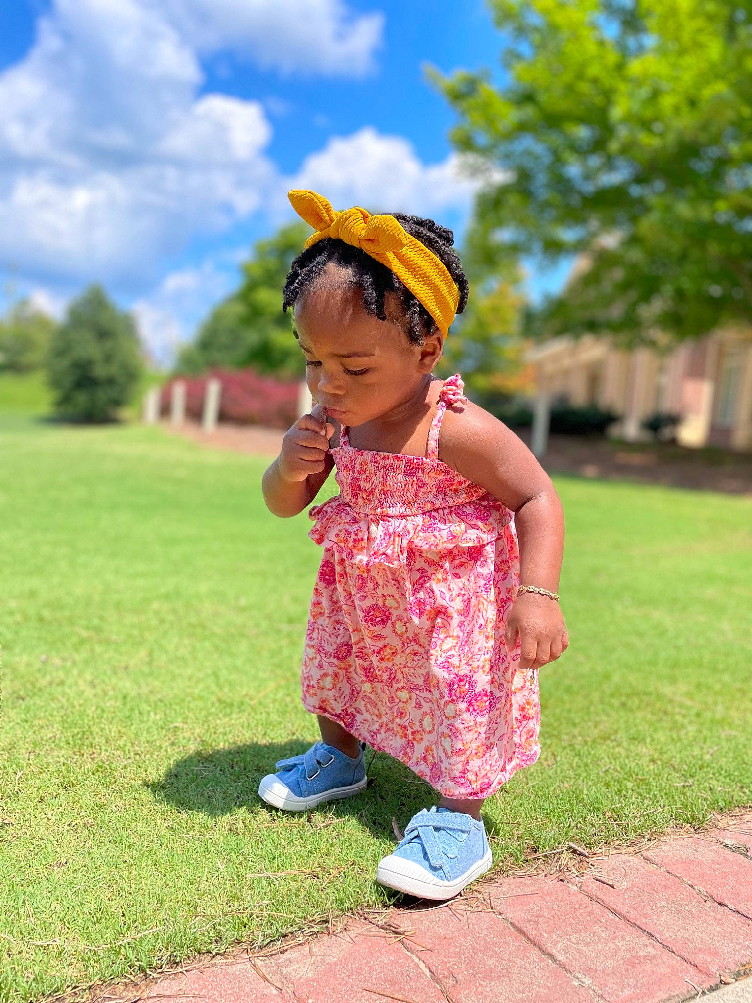 Xaya Rose is registered to the contest to win money with this photo: baby_toddler_clothing, child, cloud, electric_blue, footwear, fun, grass, grassland, green, happy, landscape, leisure, people_in_nature, person, plant, recreation, shoe, sky, sneakers, toddler