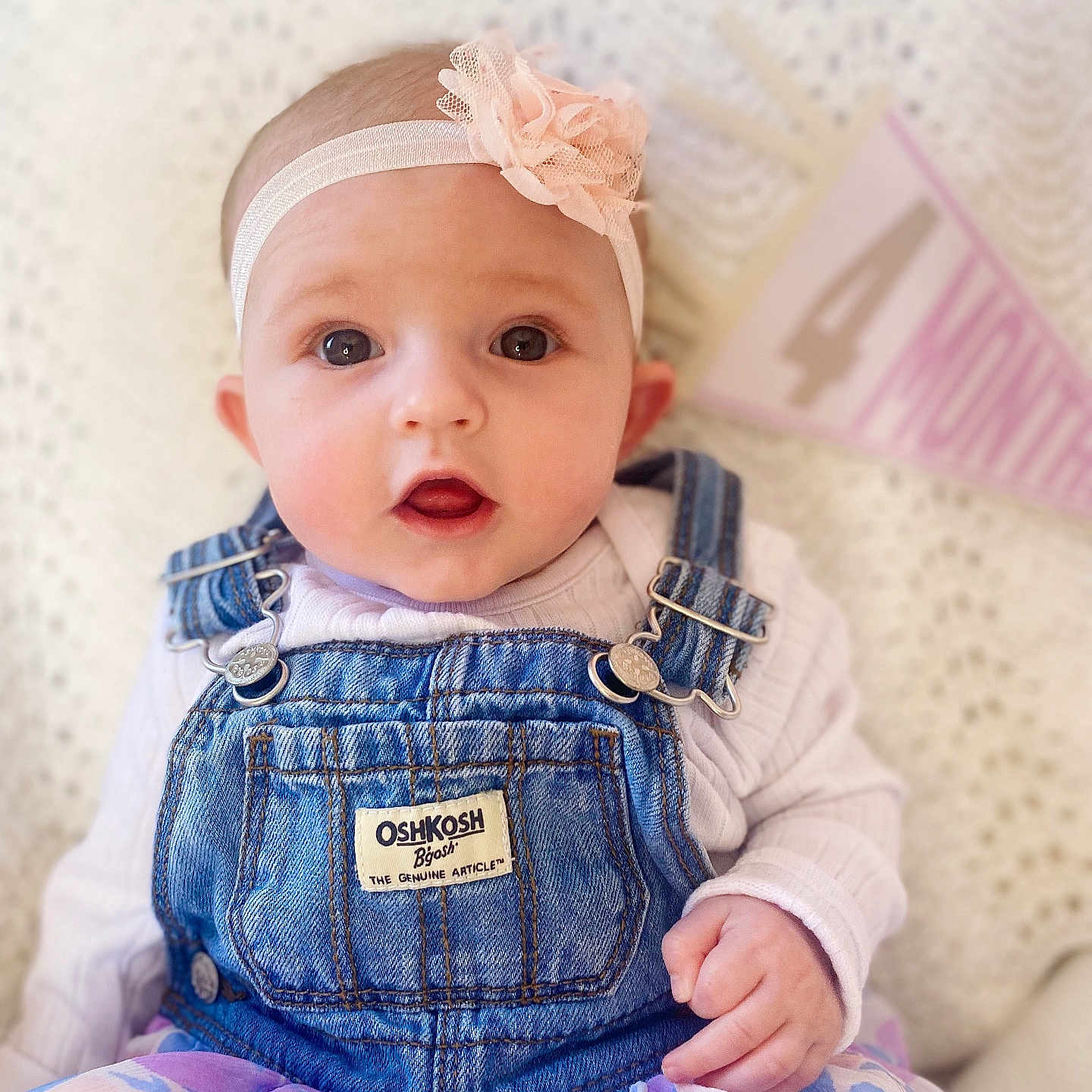 Allie is registered to the contest to win money with this photo: accessories, baby, clothing, coat, costume, couch, dress, face, furniture, hat, head, headband, jacket, jeans, newborn, pants, person, photography, portrait, sitting