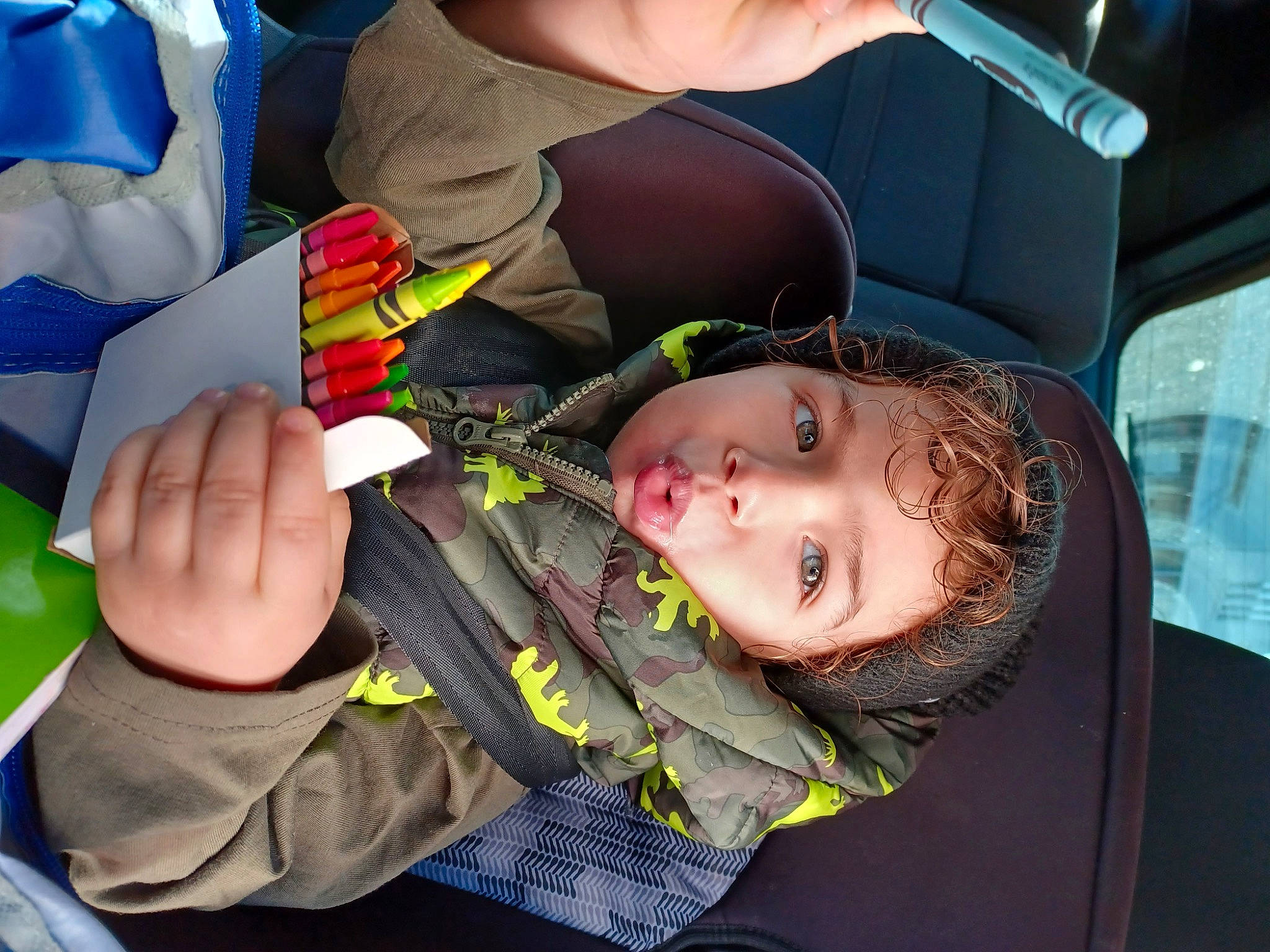 Beckham is registered to the contest to win money with this photo: baby, baby_carriage, baby_products, child, eyewear, fun, gesture, luxury_vehicle, mouth, nail, person, thumb, toddler, toy, vehicle_door, wrist