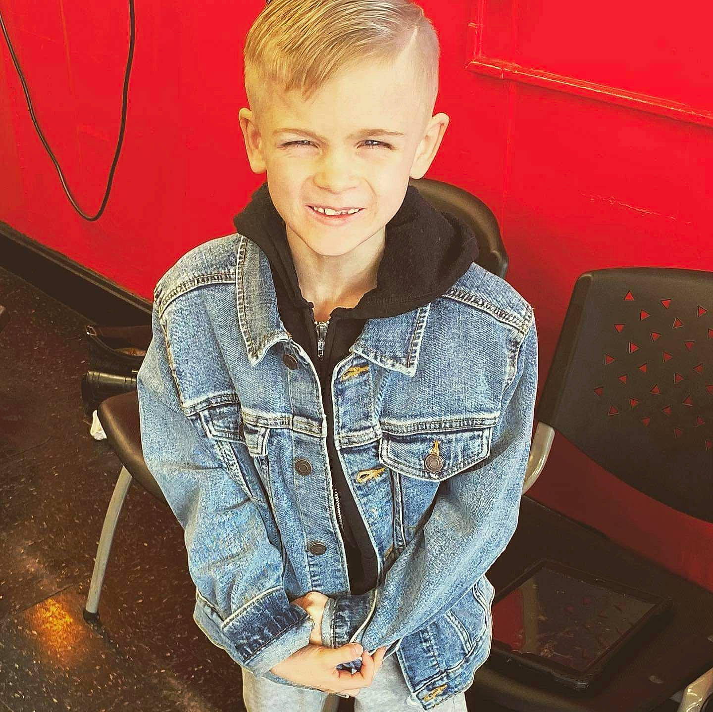 Maddox joined the competition — help win amazing prizes! blond, child, collar, denim, dress_shirt, electric_blue, eyewear, face, hairstyle, happy, head, human_leg, jeans, joy, person, sitting, sleeve, smile, street_fashion, t_shirt