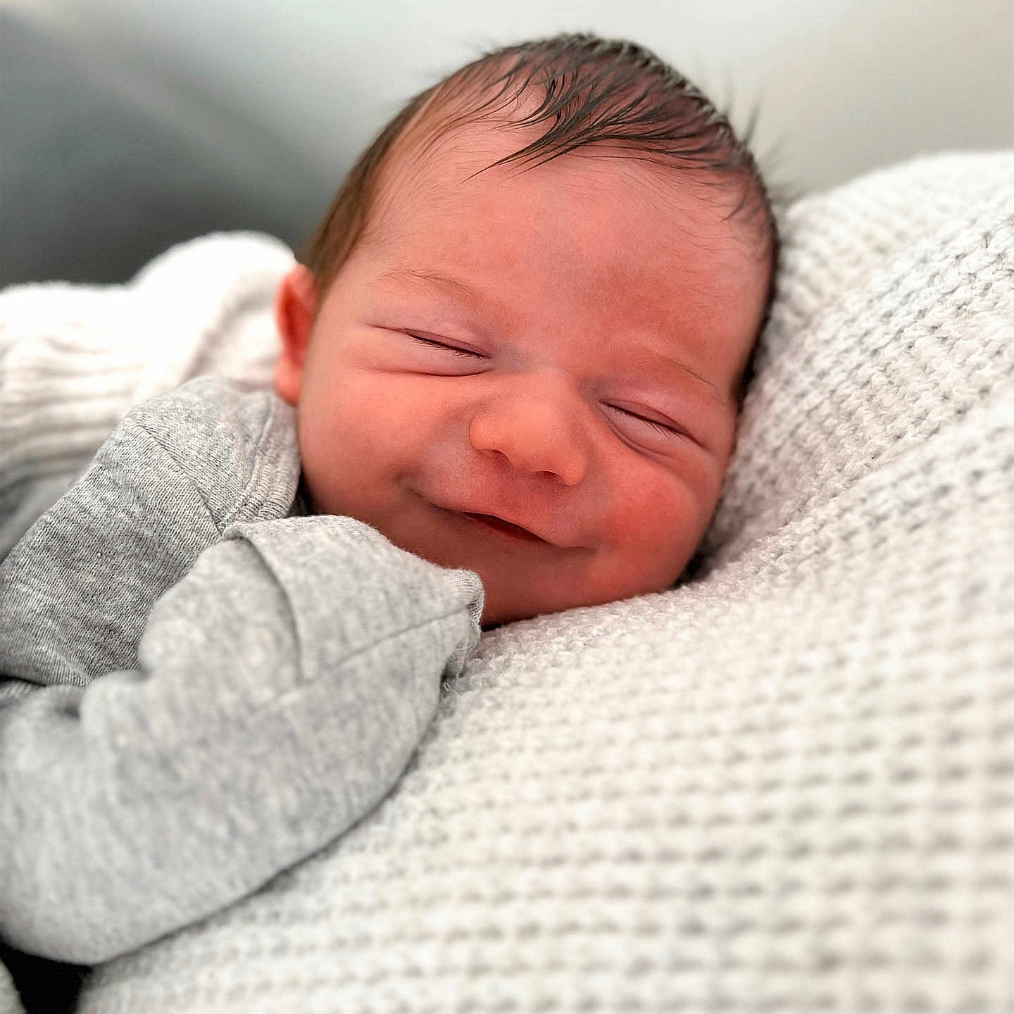 Grayson is registered to the contest to win money with this photo: baby, blanket, closeup, clothing, comfort, cozy, cute, face, head, human, infant, newborn, peaceful, portrait, rest, skin, sleeping, smile, soft, texture
