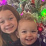 Skyler joined the competition — help win amazing prizes! child, children, smiling, happy, christmas_tree, holiday, ornaments, lights, decorations, indoors, festive, sibling, toddler, girl, boy, face, portrait, celebration, joy, family