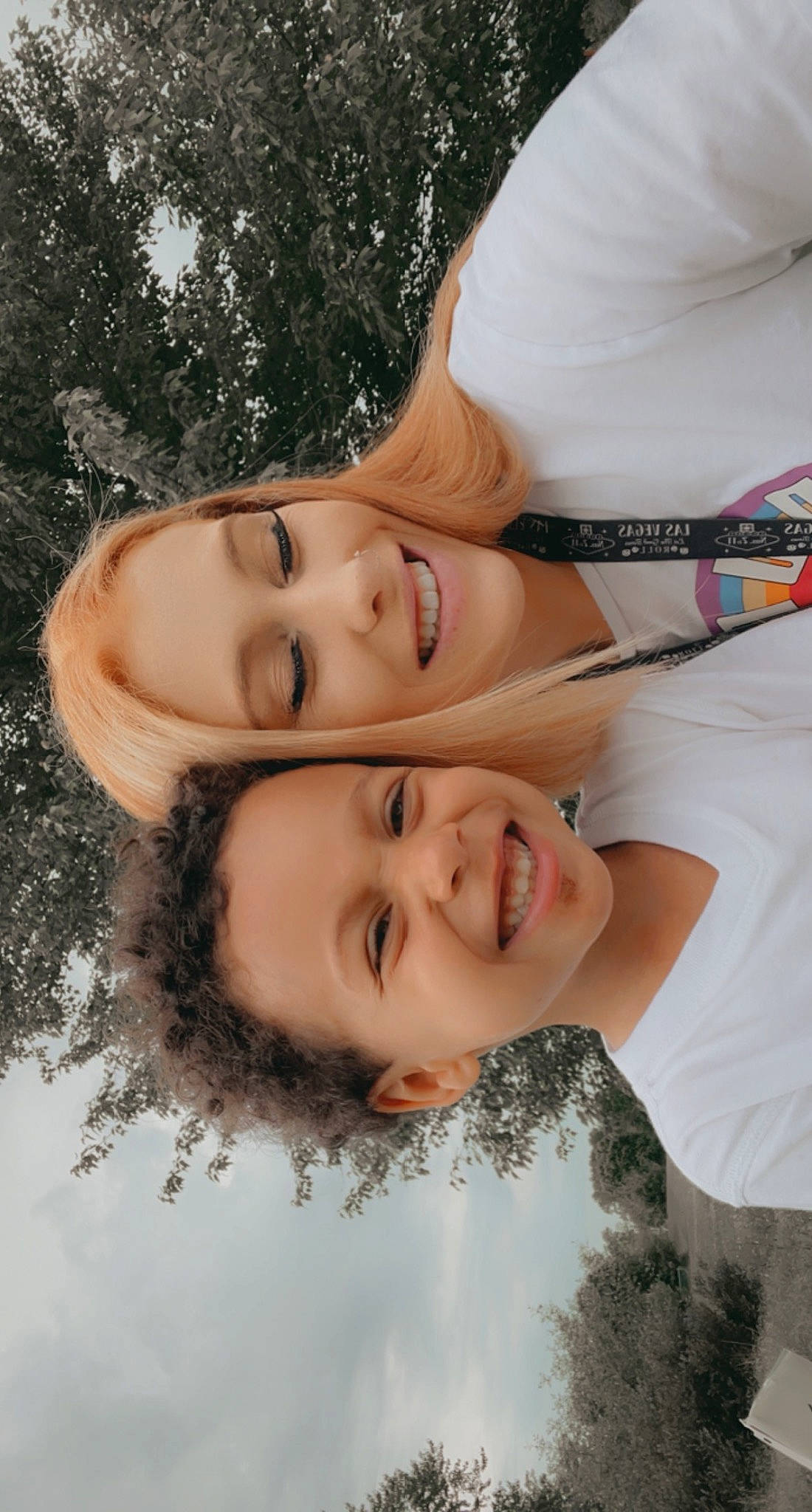 Keegan is registered to the contest to win money with this photo: chin, eye, eyebrow, face, facial_expression, flash_photography, gesture, grass, hairstyle, happy, joy, lip, mammal, mouth, neck, nose, people_in_nature, person, plant, skin