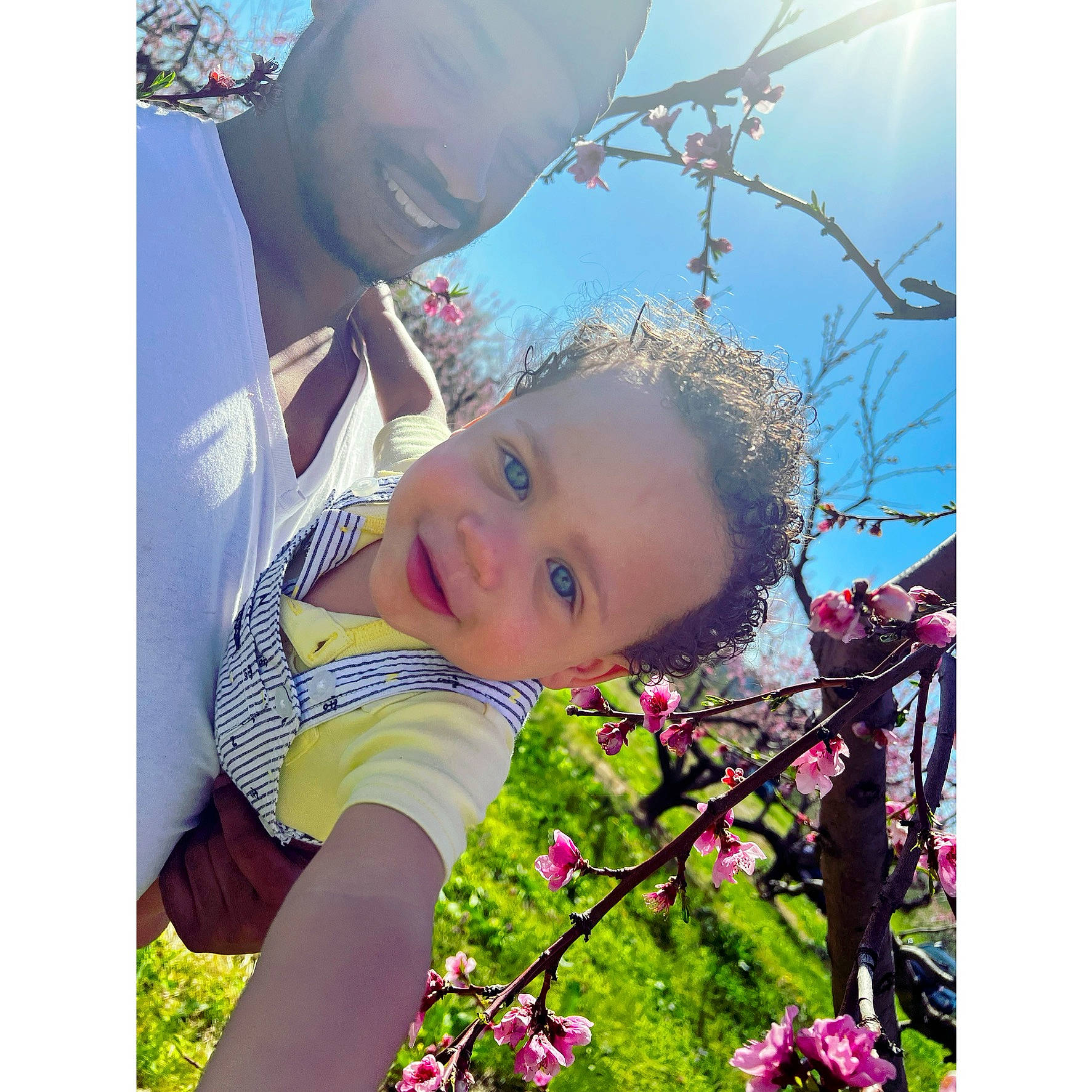 Legend joined the competition — help win amazing prizes! baby, blossom, child, flower, flowering_plant, fun, gesture, grass, happy, hat, love, magenta, people_in_nature, person, petal, plant, sky, spring, toddler, twig