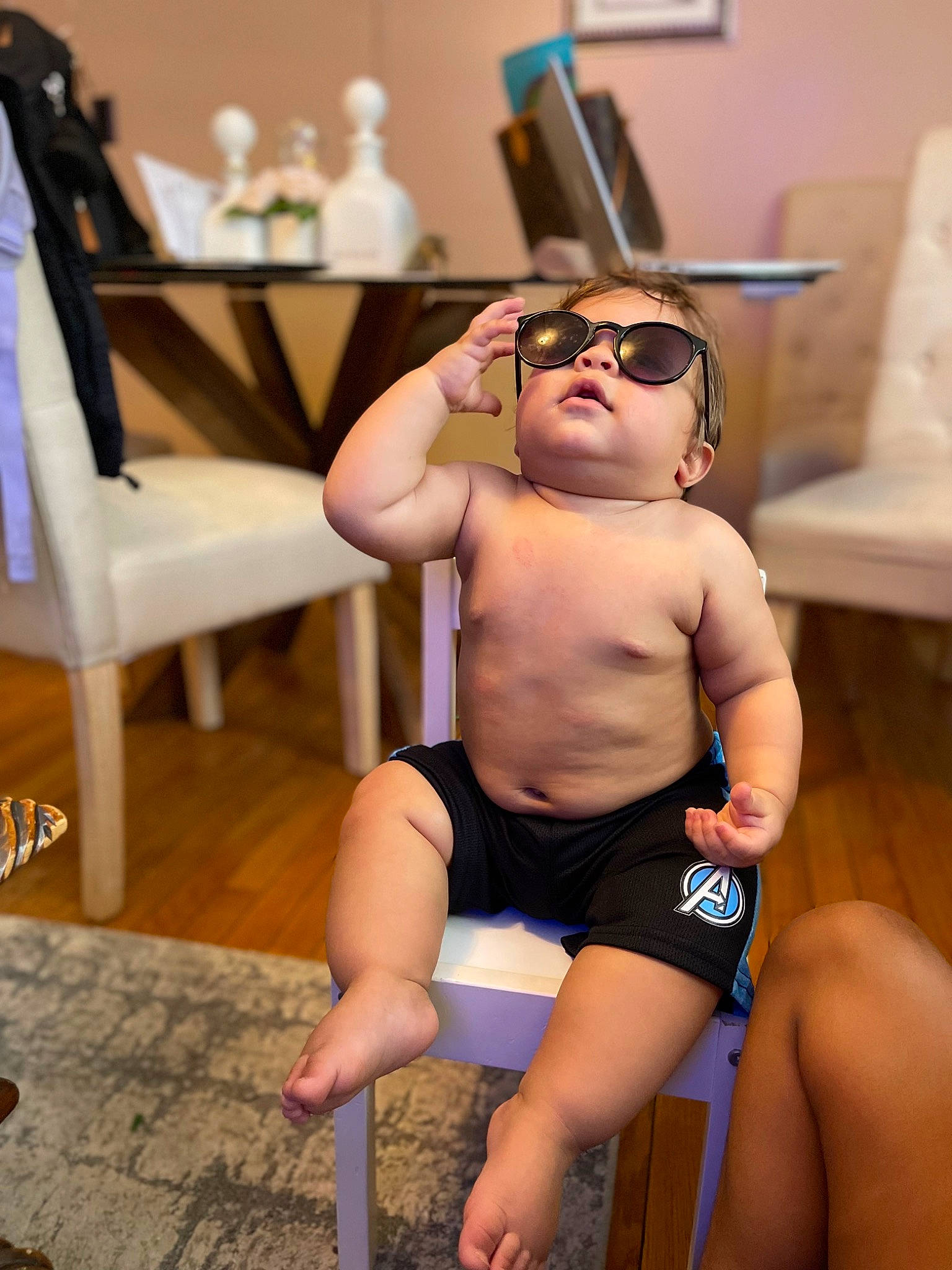 Westley joined the competition — help win amazing prizes! abdomen, chair, chest, eyewear, floor, flooring, goggles, hat, joint, knee, leg, leisure, muscle, person, shorts, sunglasses, table, thigh, toddler, trunk