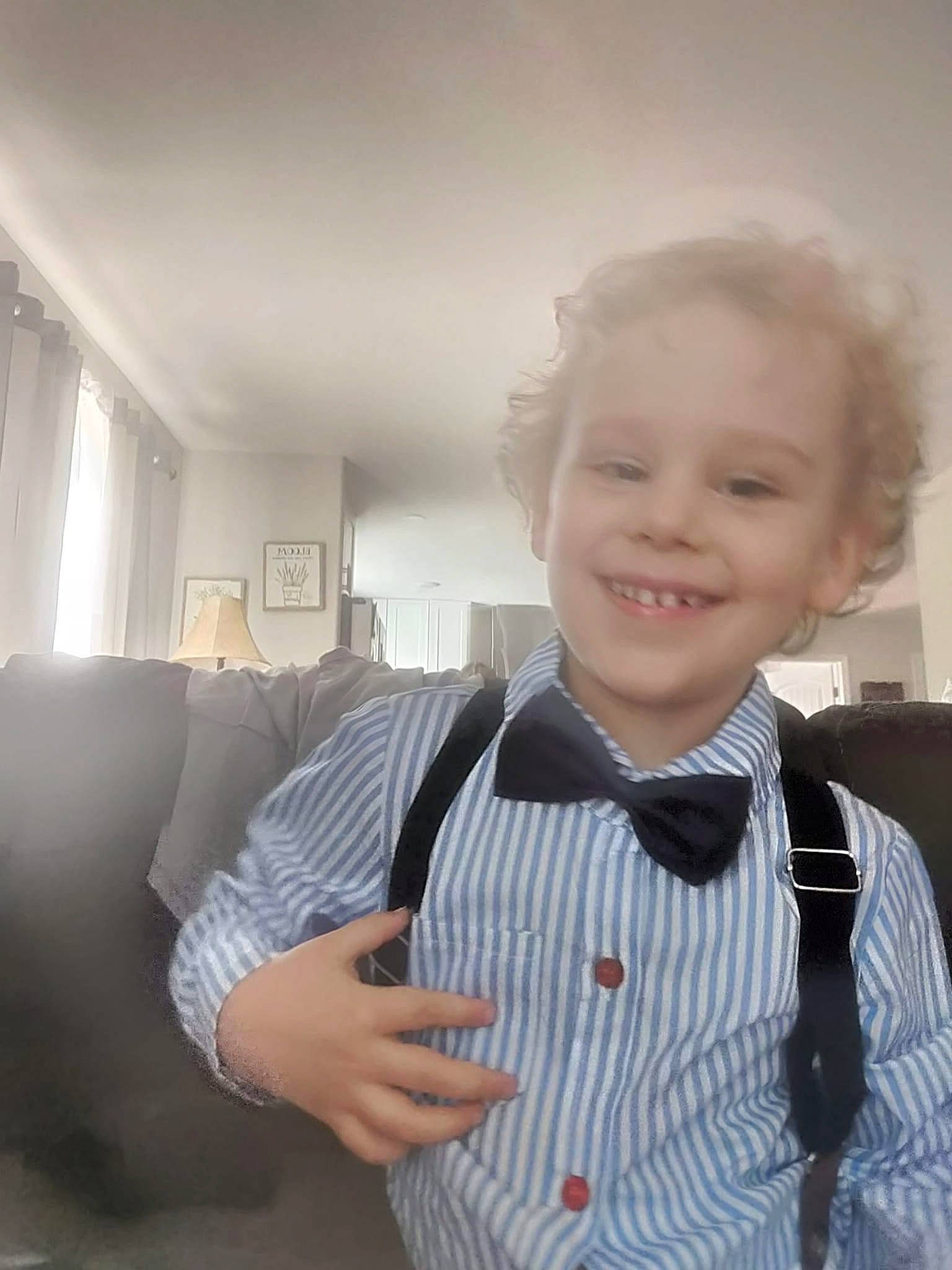 Brantley is registered to the contest to win money with this photo: baby_toddler_clothing, blazer, bow_tie, button, collar, dress_shirt, formal_wear, gesture, happy, joy, neck, person, school_uniform, shoulder, sleeve, smile, suit, t_shirt, tie, toddler